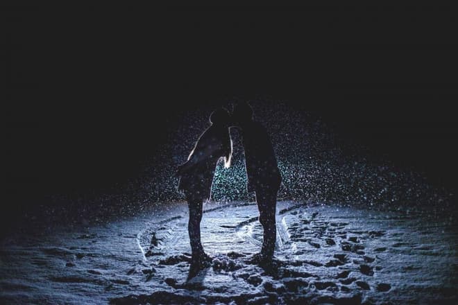 A kiss at night under the lights
